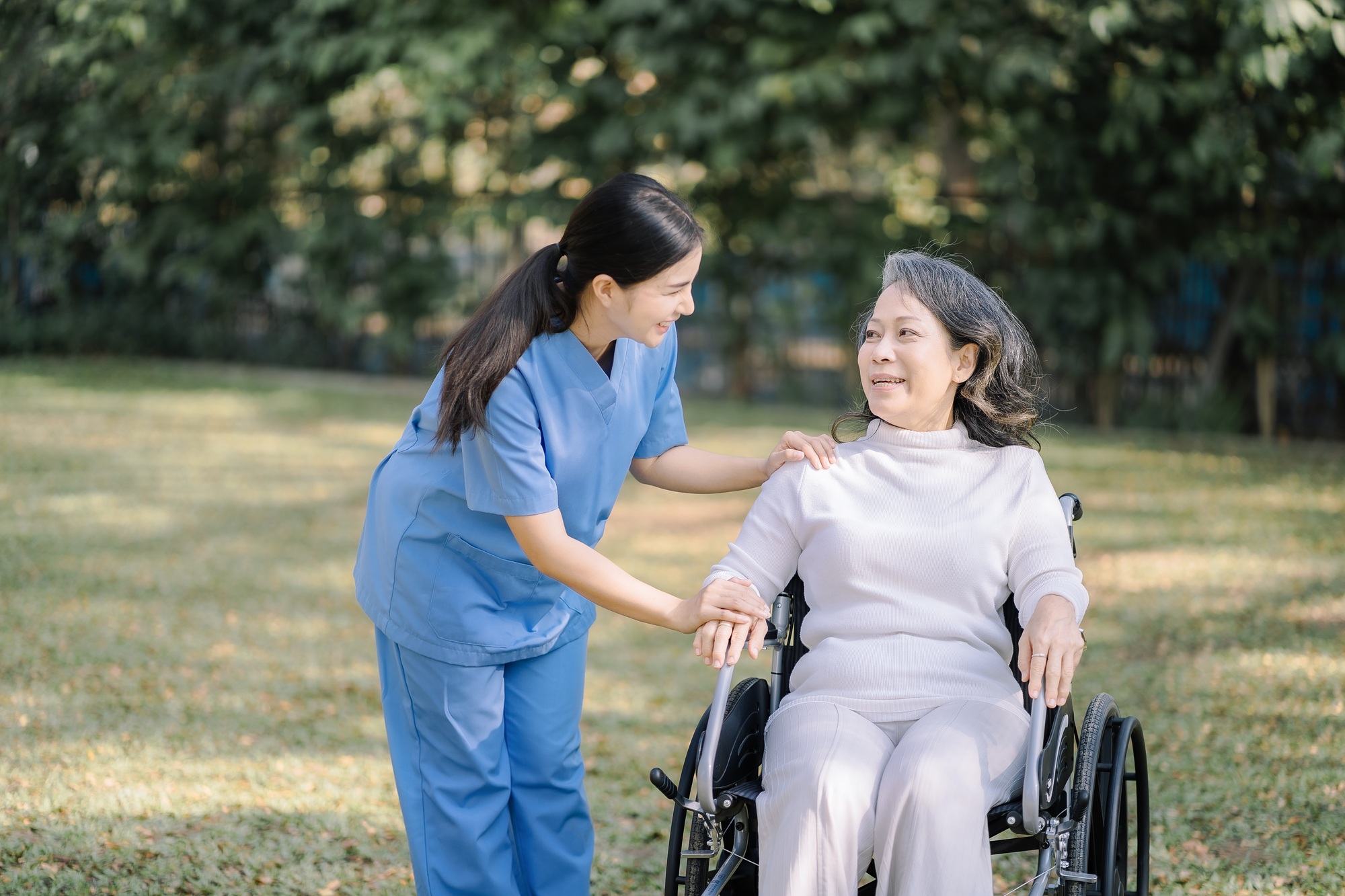 Nurse takes care of old patient.